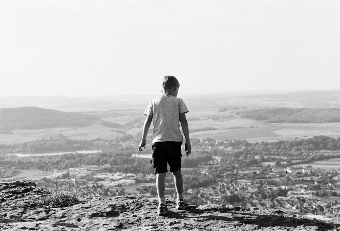 boy standing on field