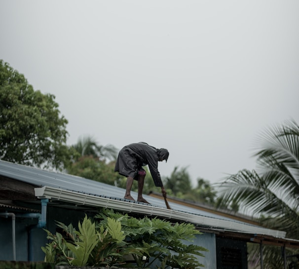 person standing on roof