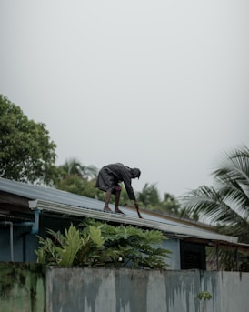 person standing on roof