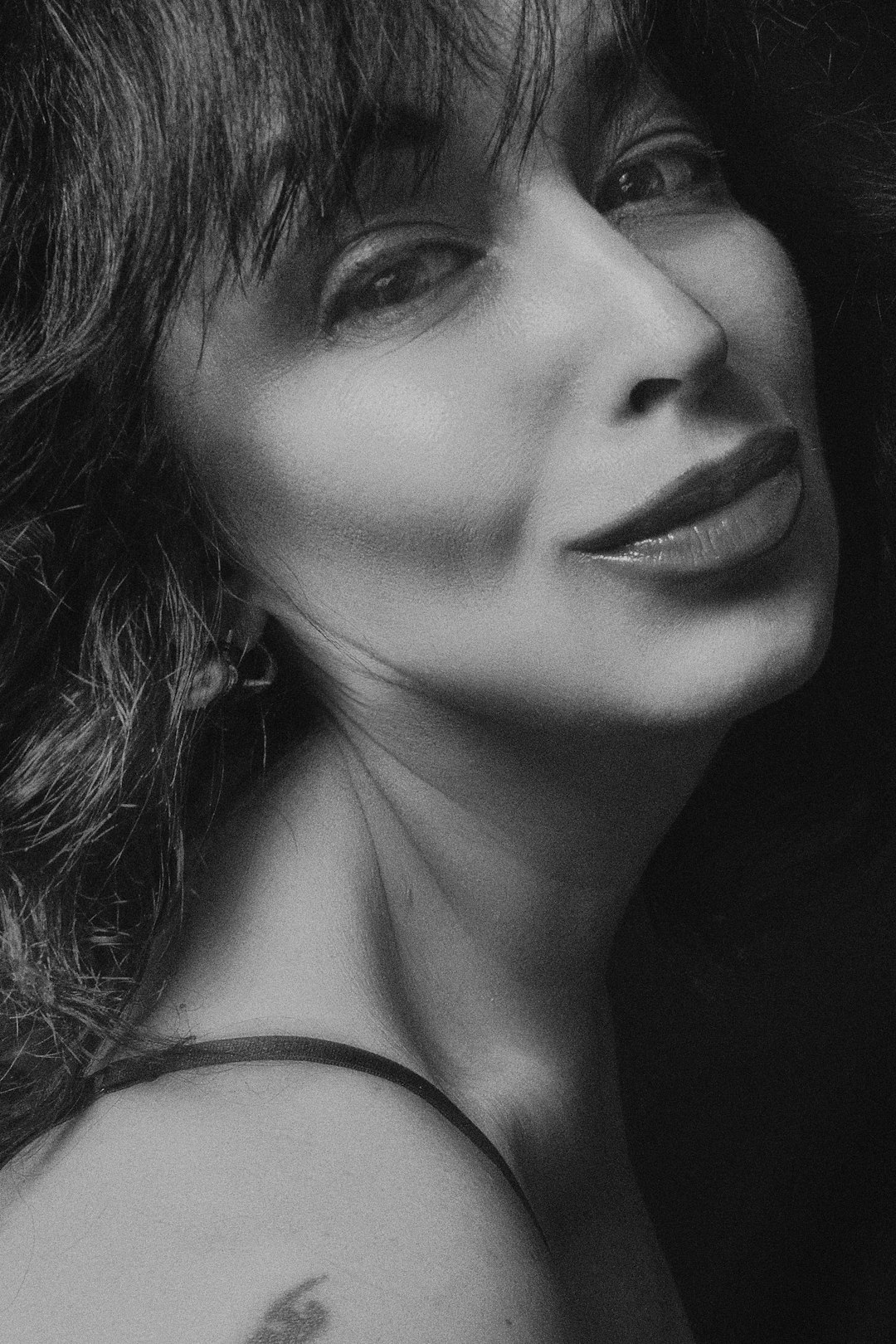 grayscale photography of woman smiling