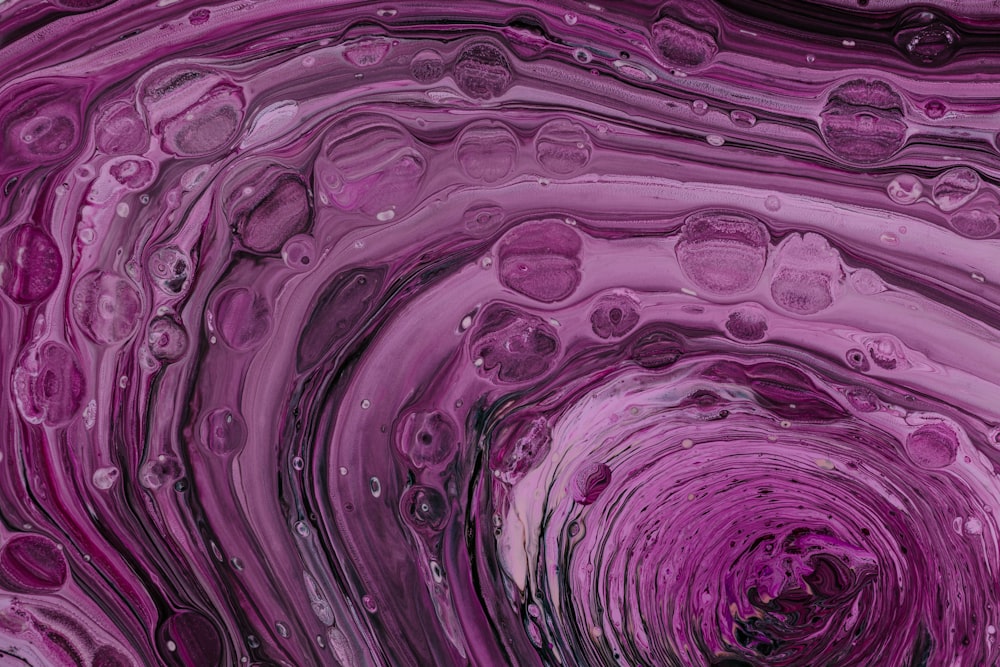 a close up of a purple and black swirl