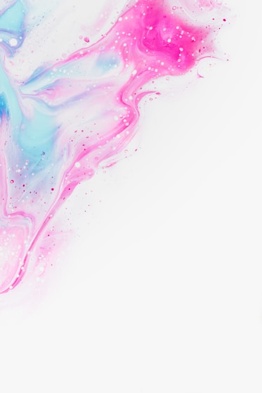 a white background with pink and blue paint