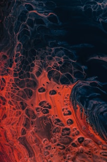 a close up of a red and black substance