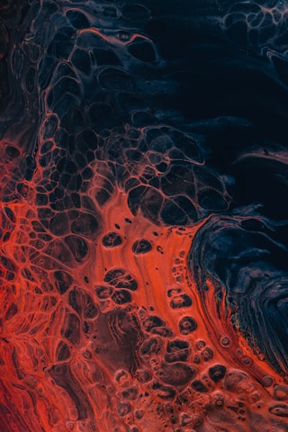 a close up of a red and black substance