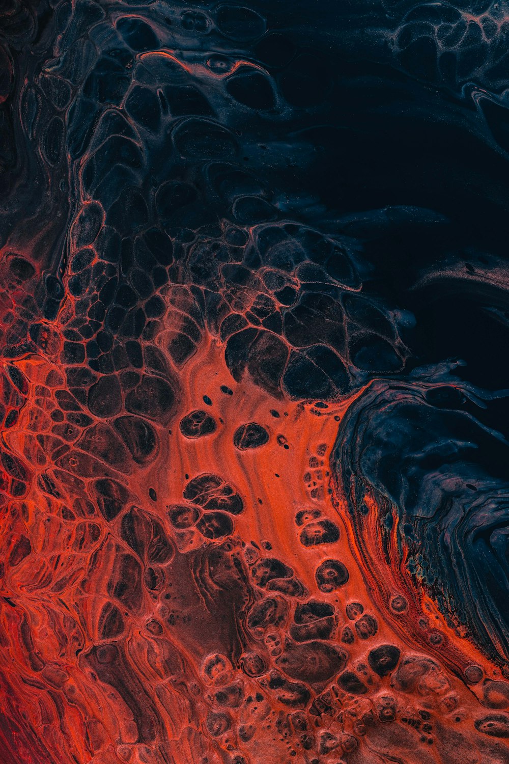 a close up of a red and black substance