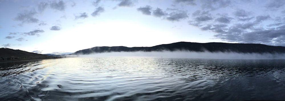 calm body of water panoramic photo