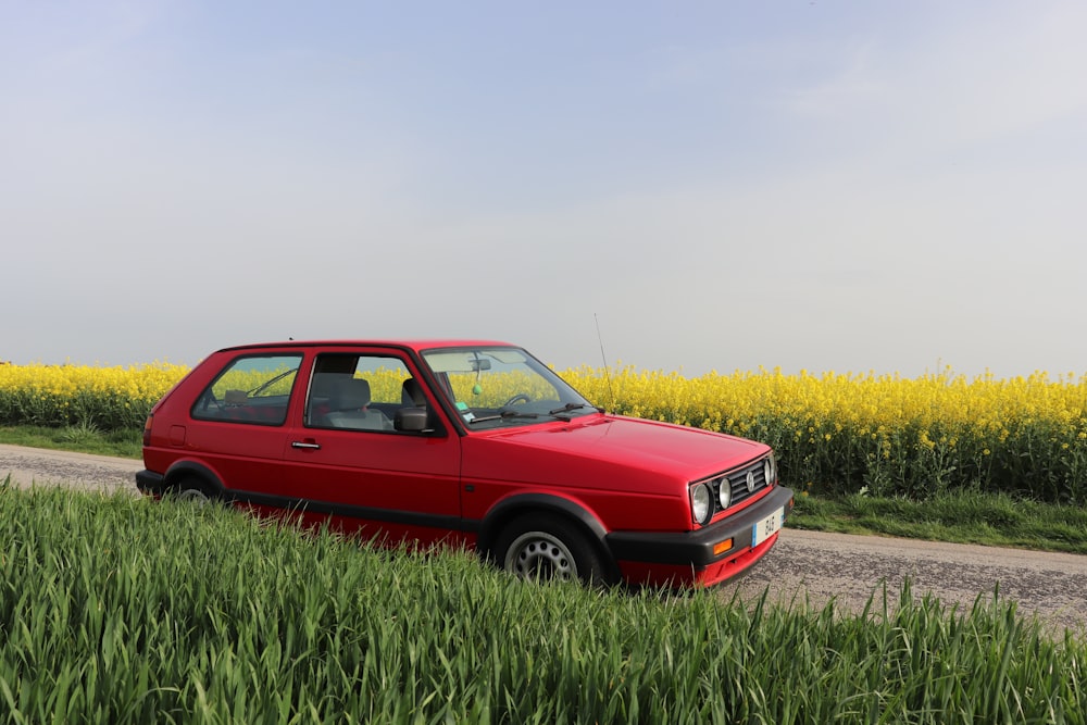 red 5-door hatchback on road