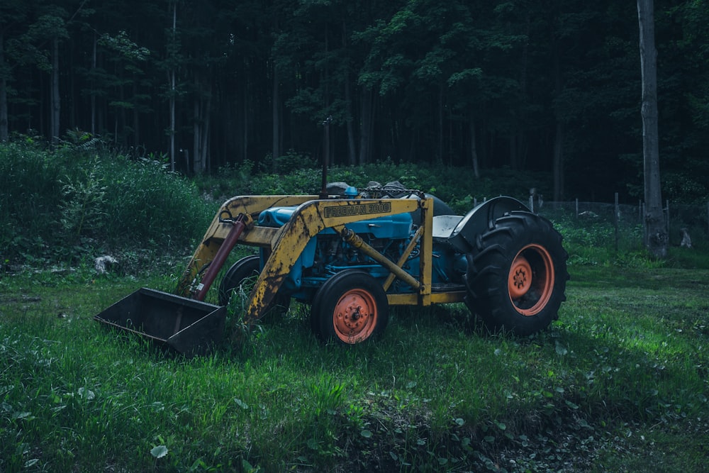 yellow and blue skid loader