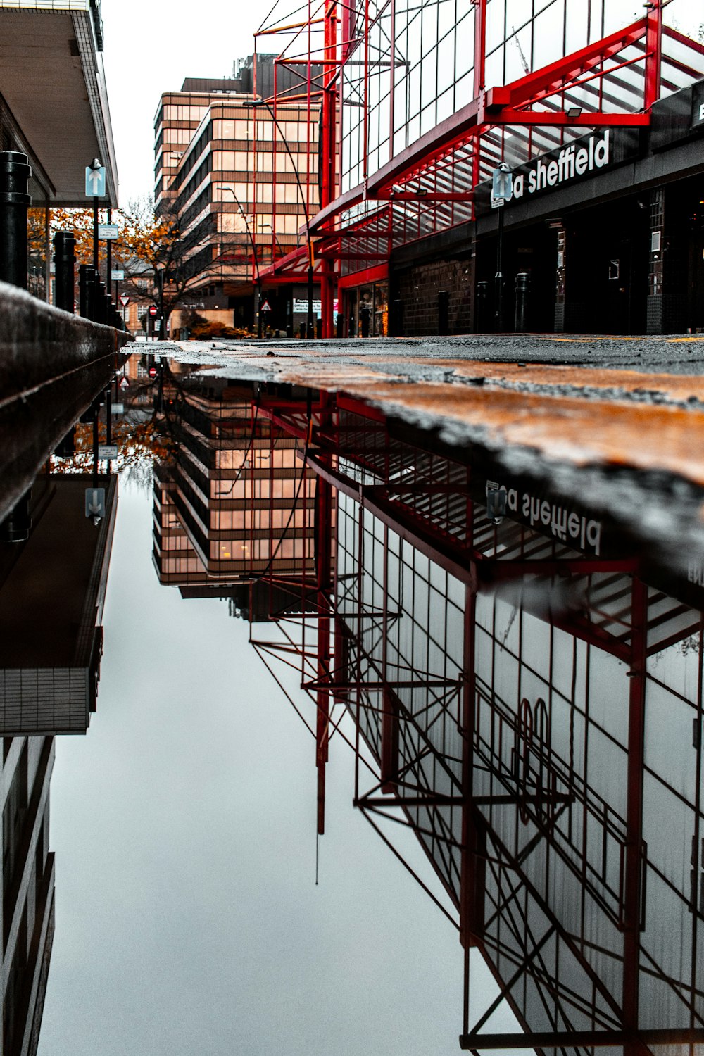 red structure near brown building