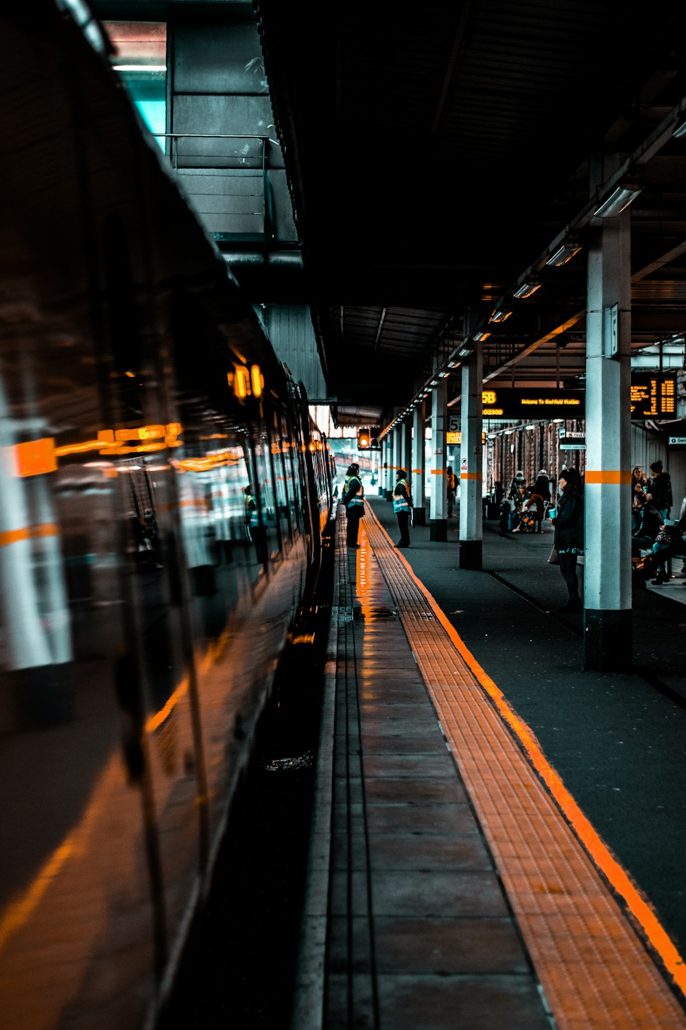 people standing near train