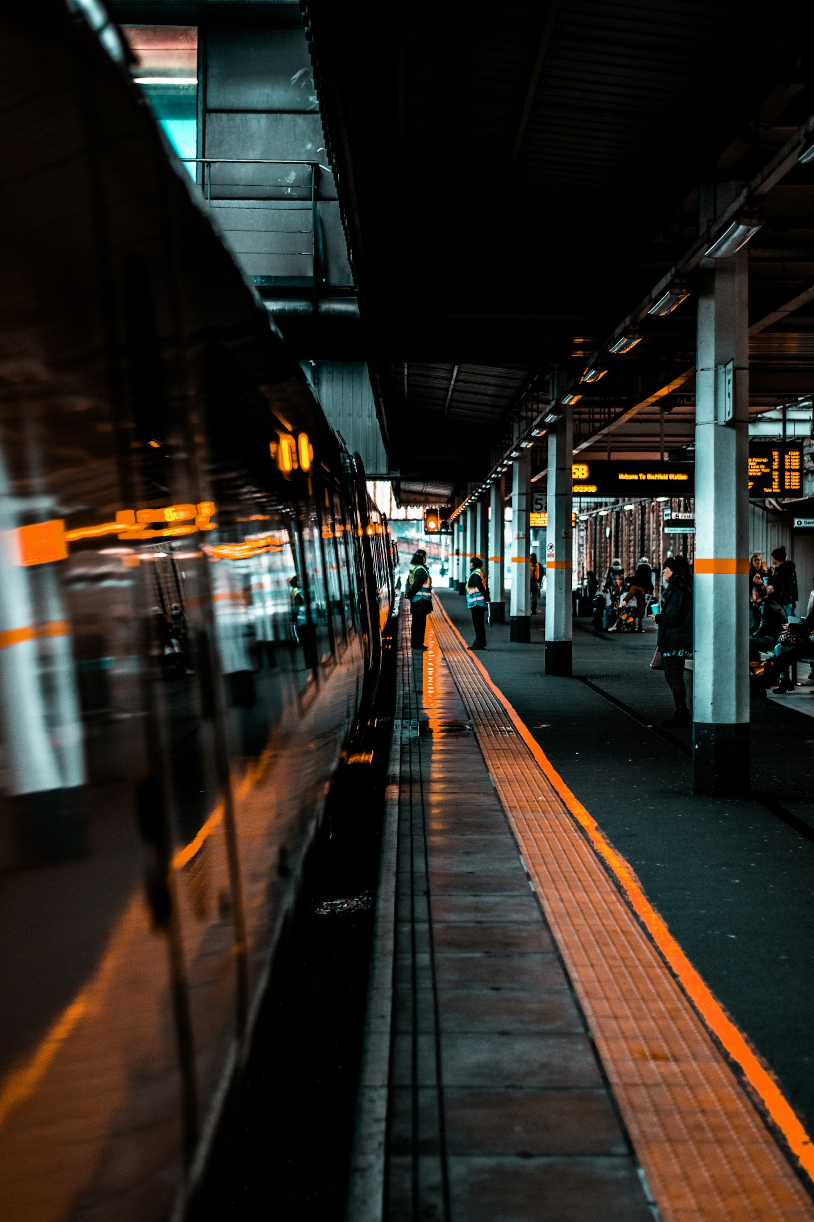 Nikon D5600 + Nikon AF-S Nikkor 50mm F1.8G sample photo. People standing near train photography