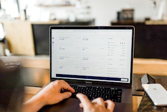 person using MacBook pro creating a google ad creative