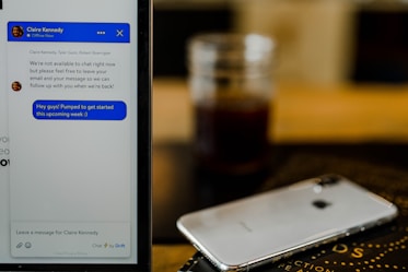 silver iPhone X on brown surface