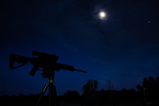 A thermal scanner mounted on a hunting rifle, ready for action at twilight.