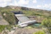 Close-up of a detailed hydro power project model with intricate water flow features.