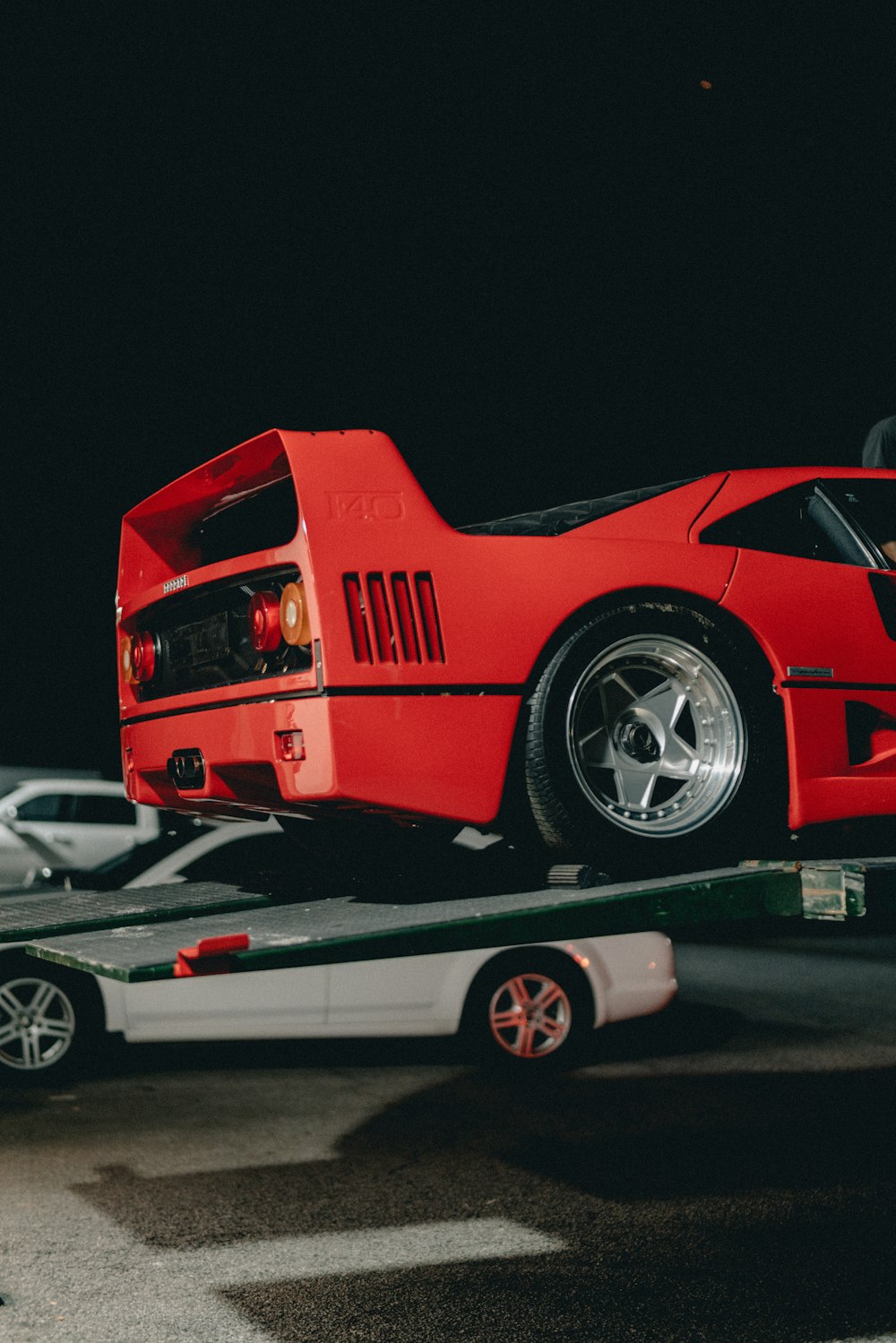 red sports car parked on truck