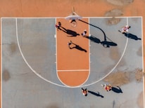 An inspiring image of a basketball court with players in action.