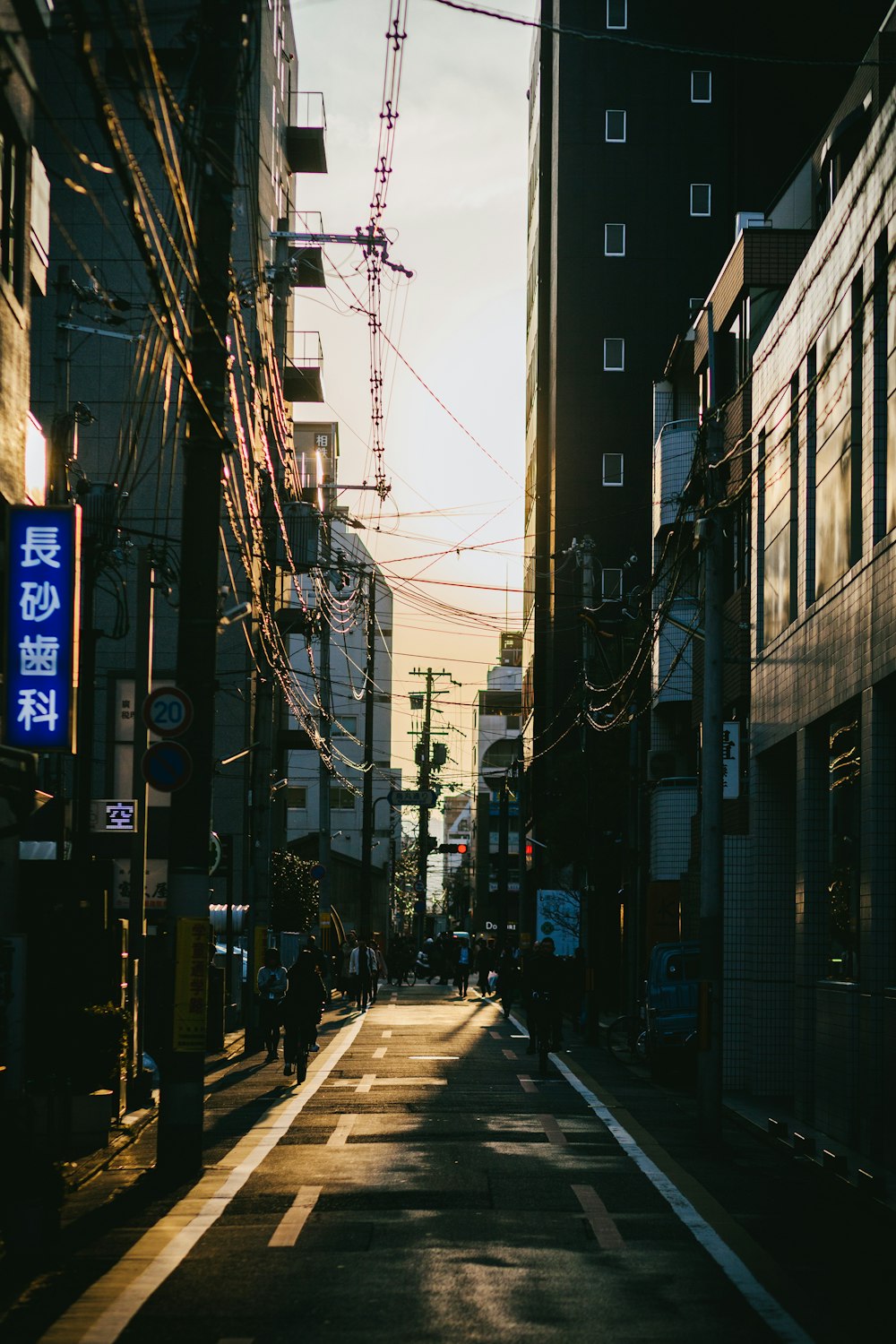 people walking on side walk during daytime