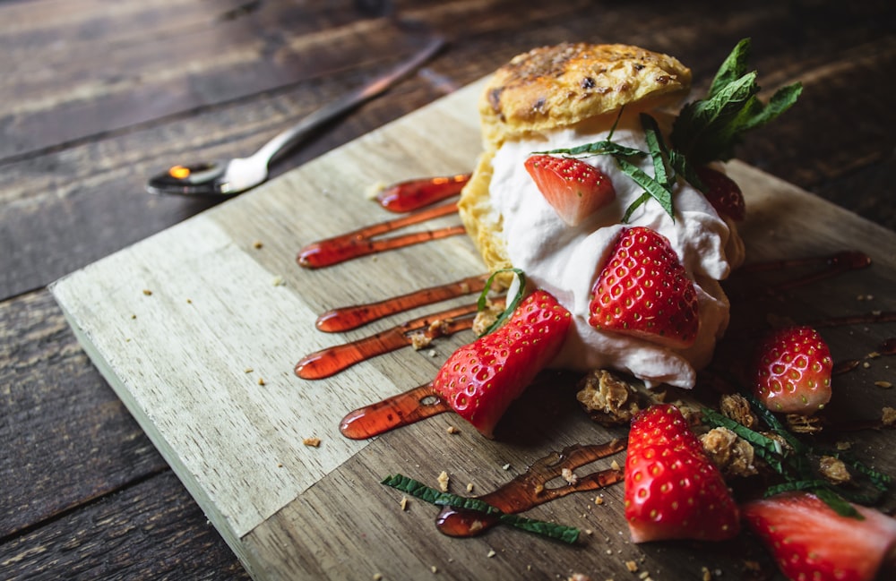 strawberry fruit on chopping board