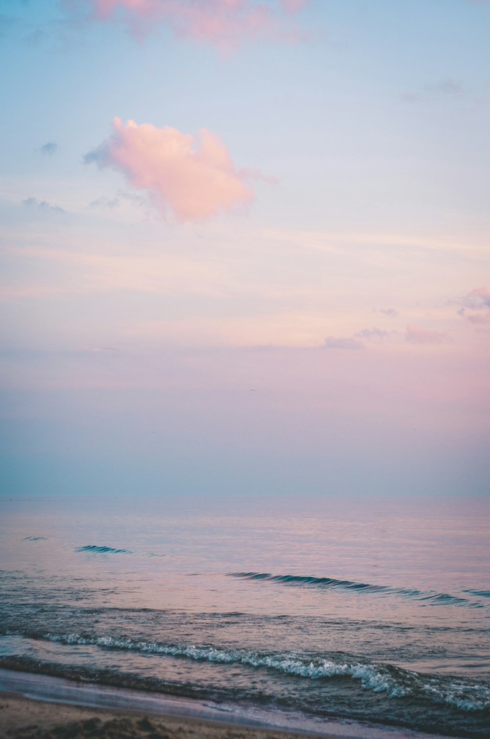 ocean under cloudy sky