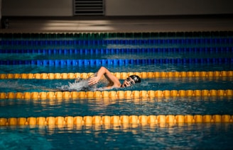 person diving in pool