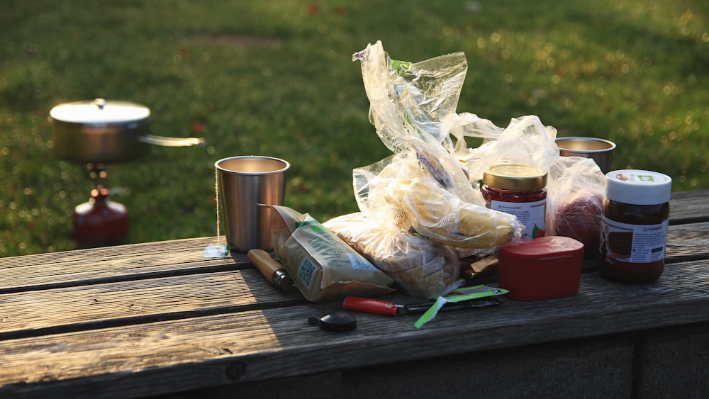 labeled containers on brown bench