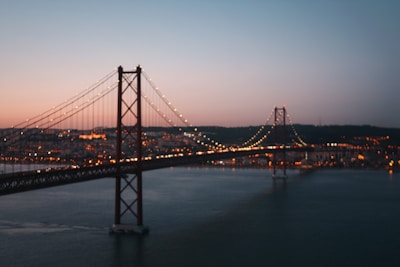lighted string lights on bridge during night