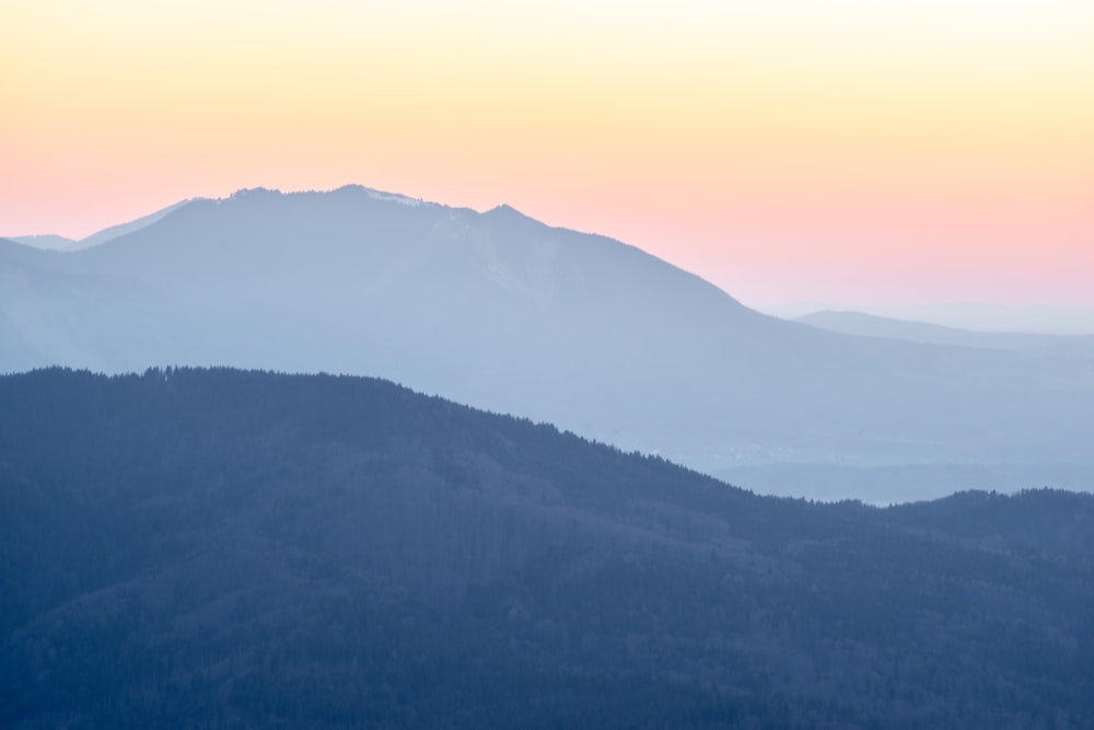 a view of a mountain range at sunset