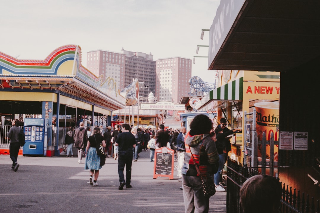 people walking on carnival during daytime