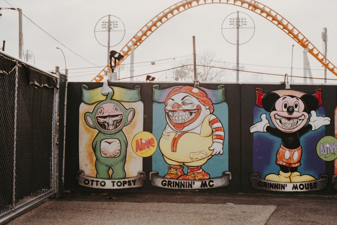 three character graphic wall during daytime