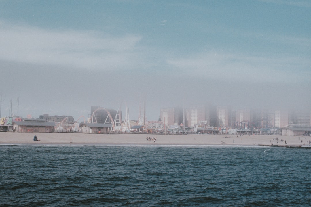 high-rise and mid-rise buildings in front of ocean