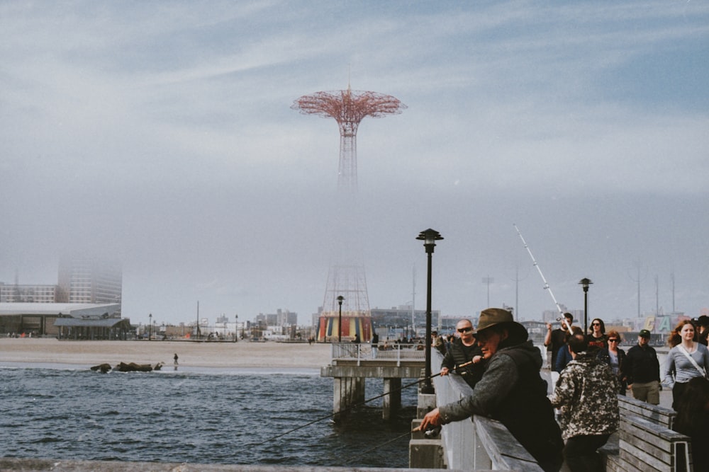 men fishing on pier