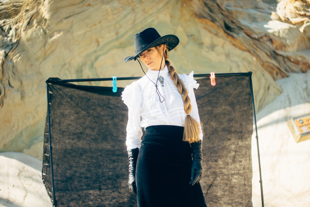 woman wearing blue cowboy hat