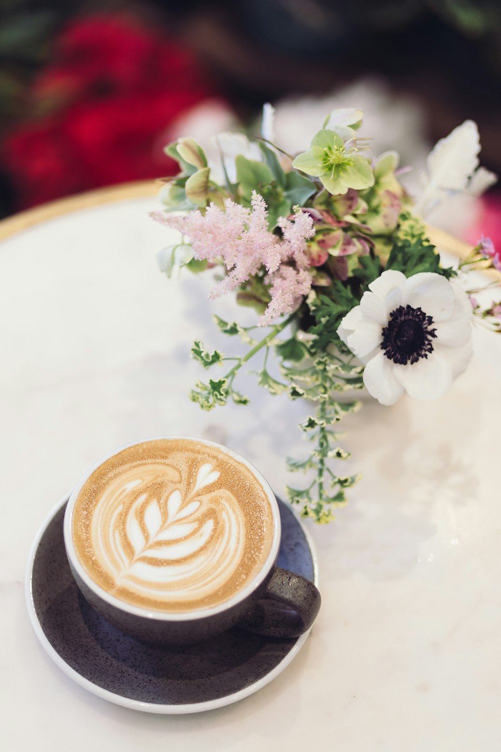 blue ceramic teacup with latte