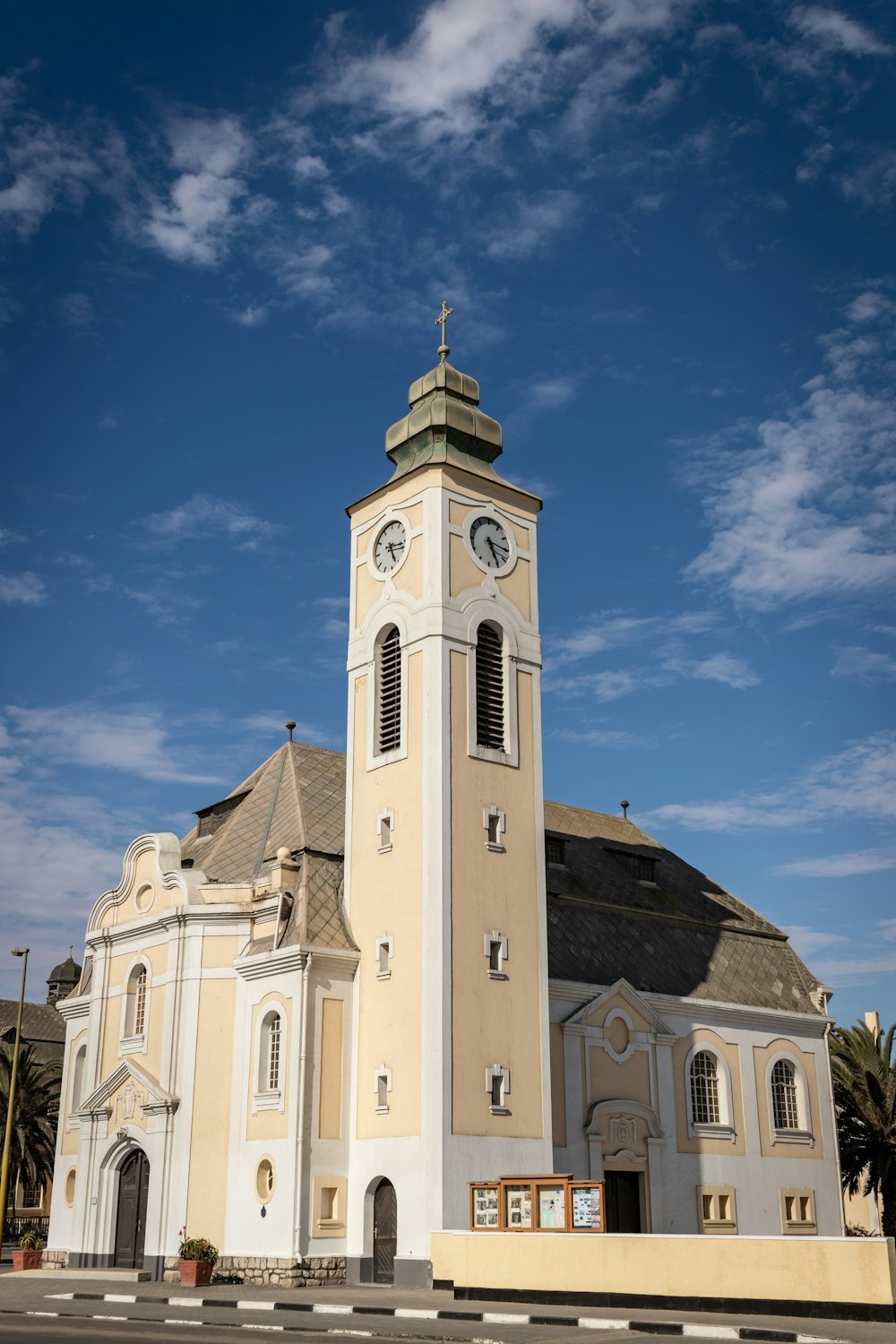 white concrete building with tower during daytime