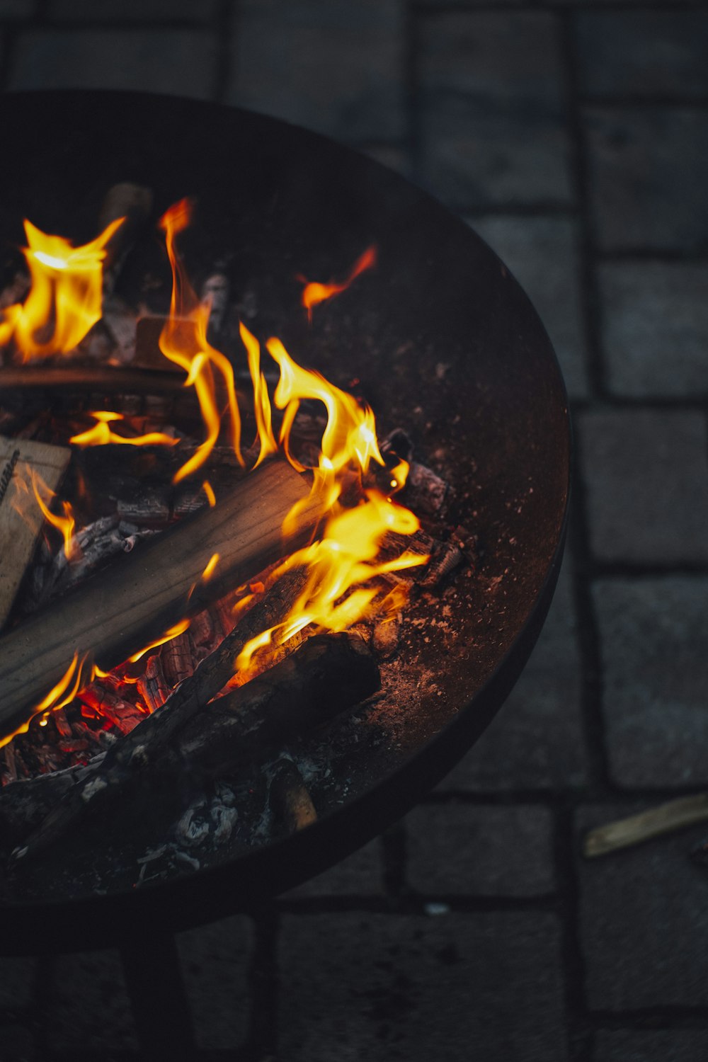 a close up of a grill with flames