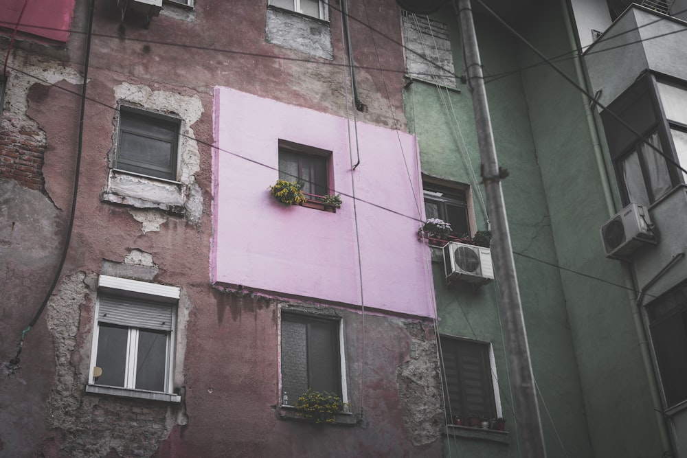 pink and brown wall during daytime