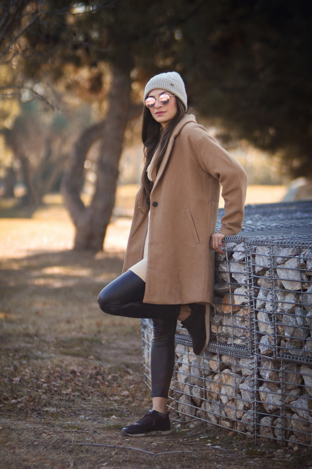 woman leaning on fence