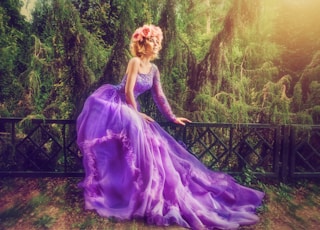 woman wearing purple dress in forest