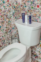 white toilet bowl with cistern