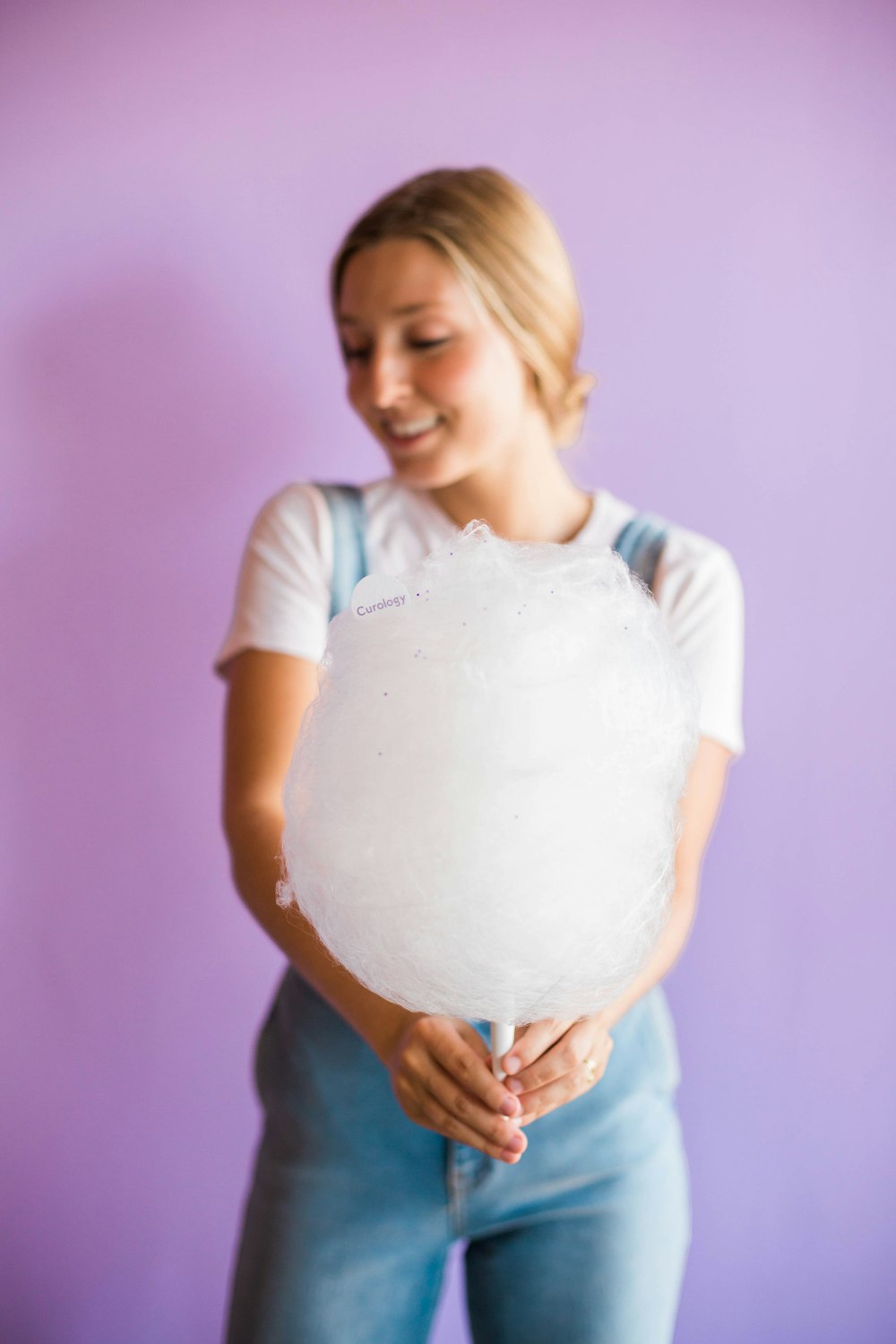 woman holding cotton candy