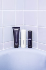 three assorted bath products