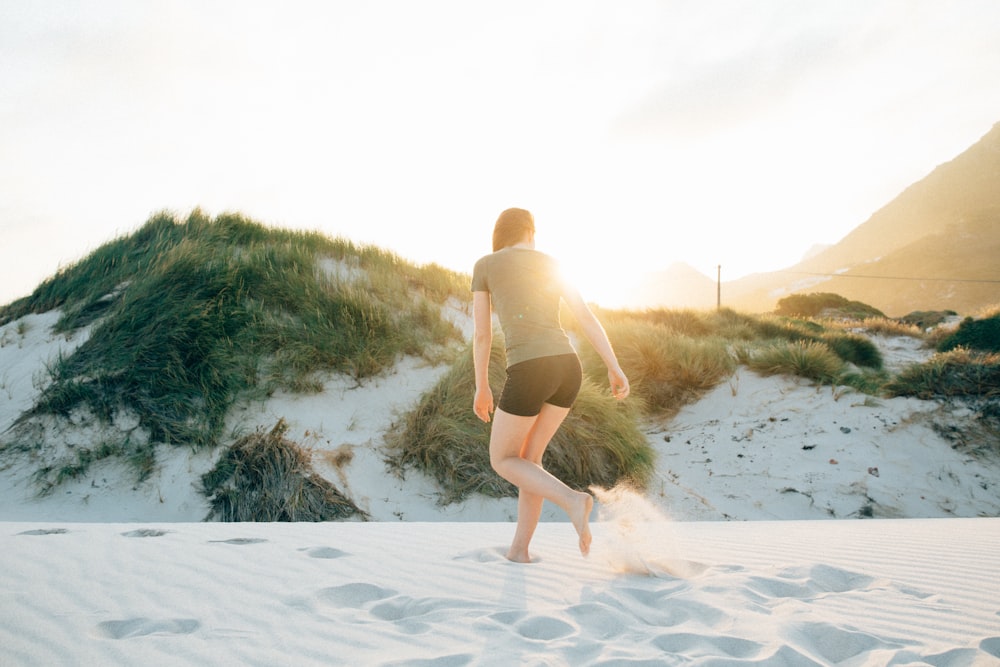 woman standing on white stand during golden hour