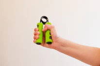 Close-up of hands demonstrating a gentle physiotherapy exercise.