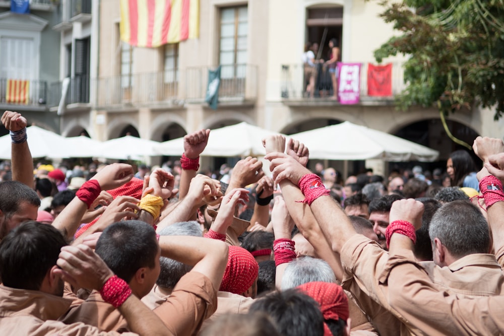 people raising hands \