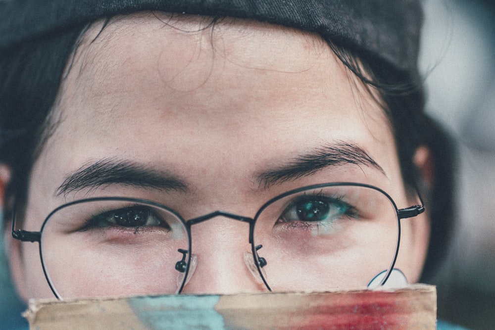 person wearing black hat and eyeglasses