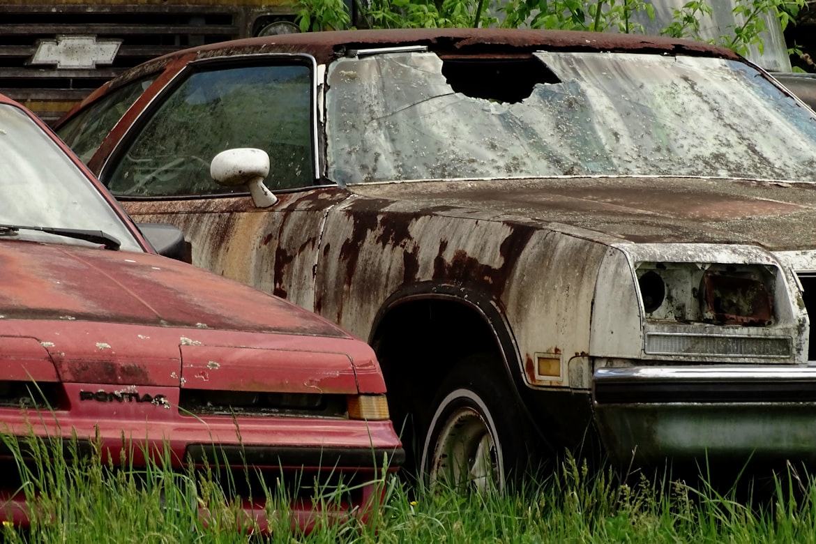 an old car with a broken windshield