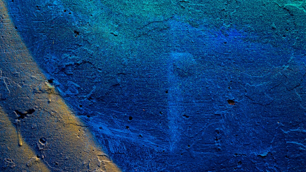 a blue and yellow painting on a wall