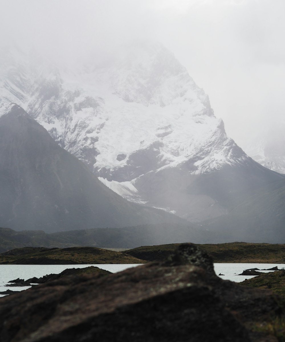 snow-capped mountain during foggy weather