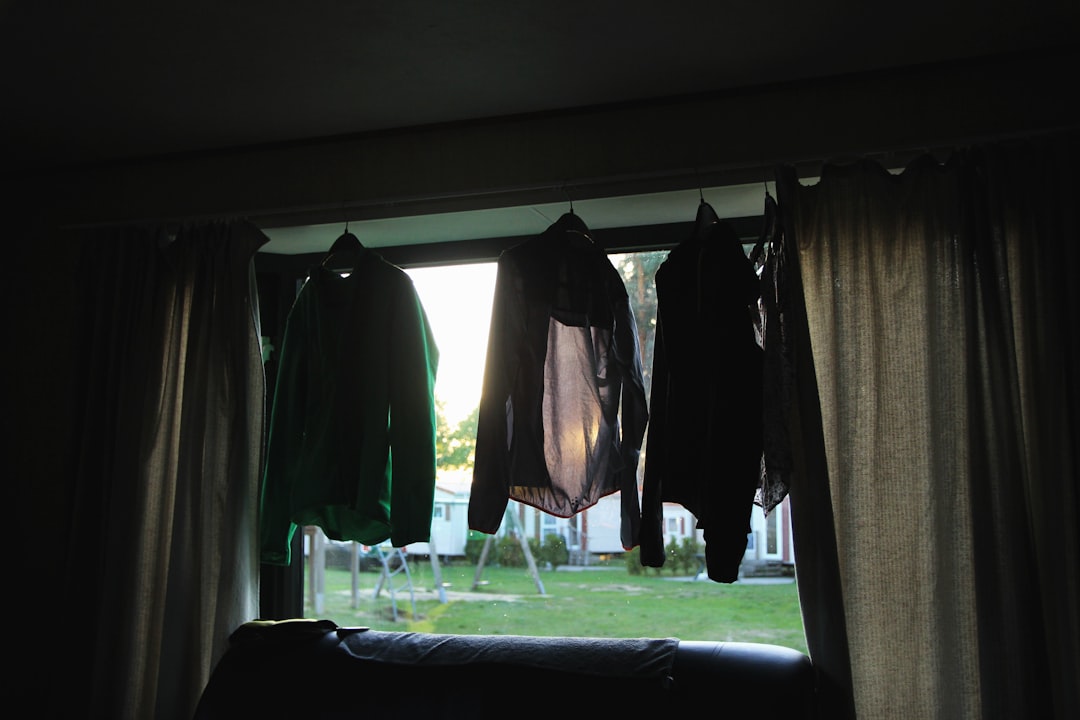 three black jackets on window